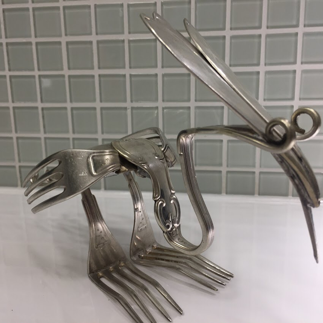 metal art objects made from coins and recycled materials